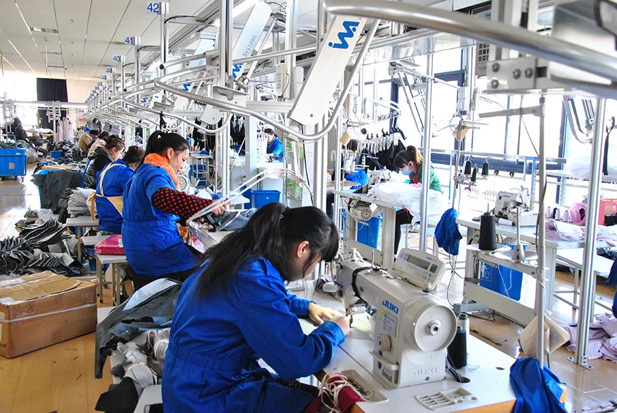 Garment assembly workers at production stations