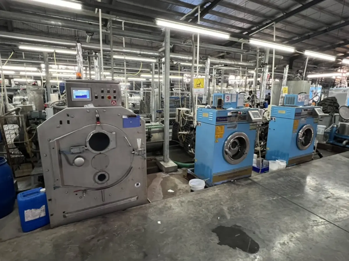 Industrial denim washing machines on the factory floor