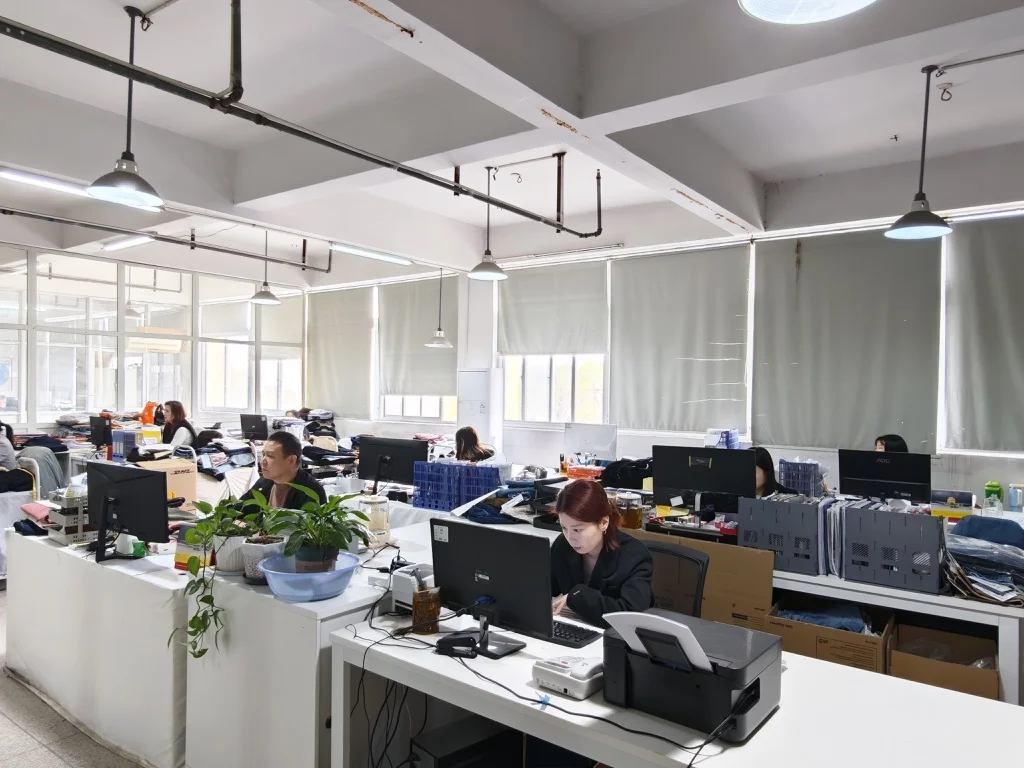 Office team members working at computer workstations